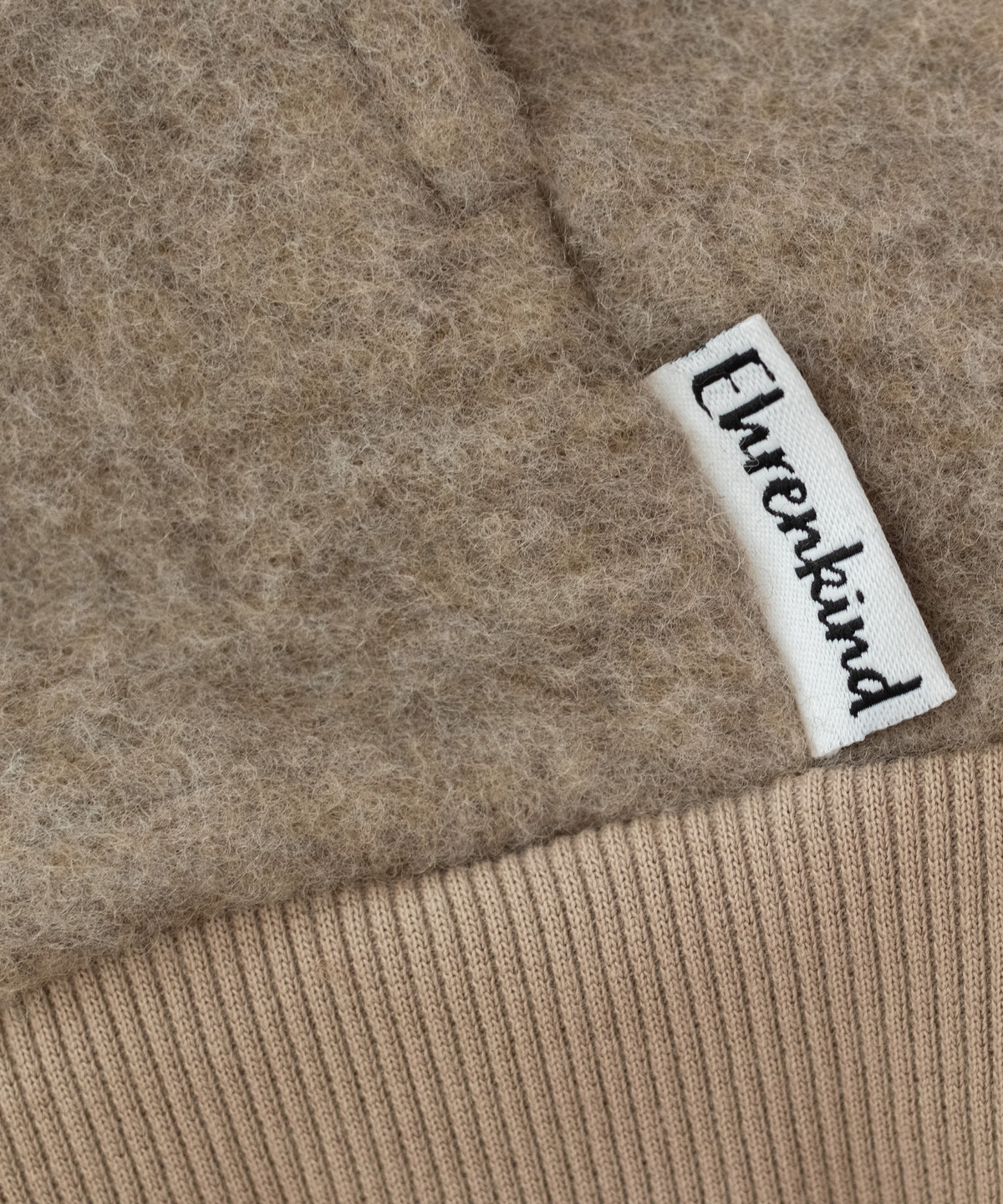 Nahaufnahme Wollfleecestoff Jacke Beige.